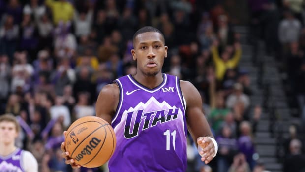 Feb 6, 2024; Salt Lake City, Utah, USA; Utah Jazz guard Kris Dunn (11) brings the ball up the court against the Oklahoma City Thunder during the fourth quarter at Delta Center.
